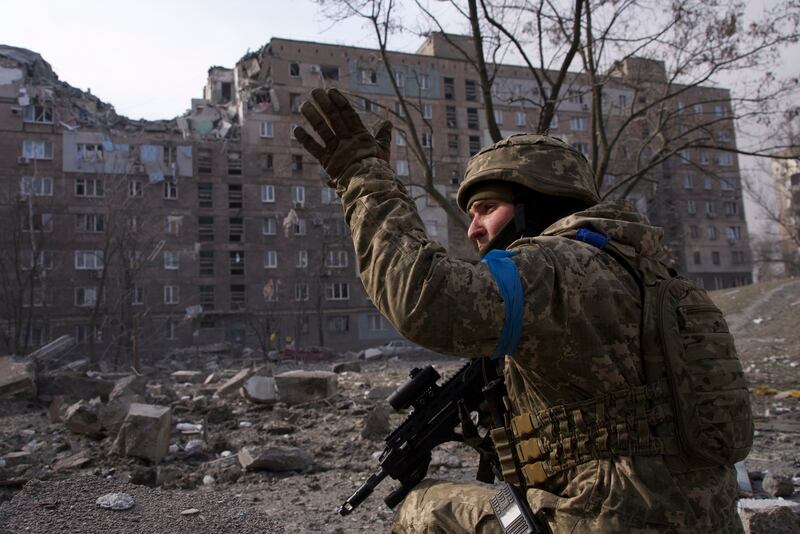 A Ukrainian serviceman guards his position in Mariupol. AP Photo