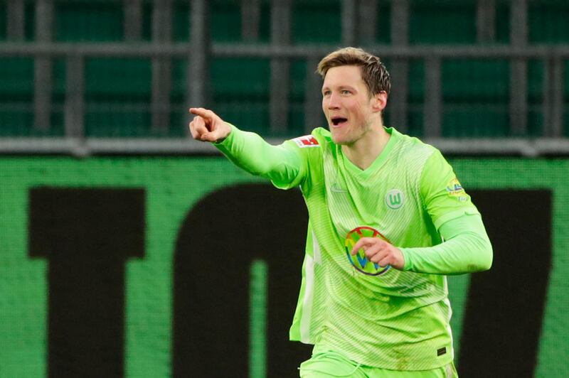 Wolfsburg's Dutch forward Wout Weghorst celebrates scoring the second goal during the German first division Bundesliga football match between WfL Wolfsburg vs Schalke 04, in Wolfsburg, on March 13, 2021.  - DFL REGULATIONS PROHIBIT ANY USE OF PHOTOGRAPHS AS IMAGE SEQUENCES AND/OR QUASI-VIDEO 
 / AFP / POOL / HANNIBAL HANSCHKE / DFL REGULATIONS PROHIBIT ANY USE OF PHOTOGRAPHS AS IMAGE SEQUENCES AND/OR QUASI-VIDEO 
