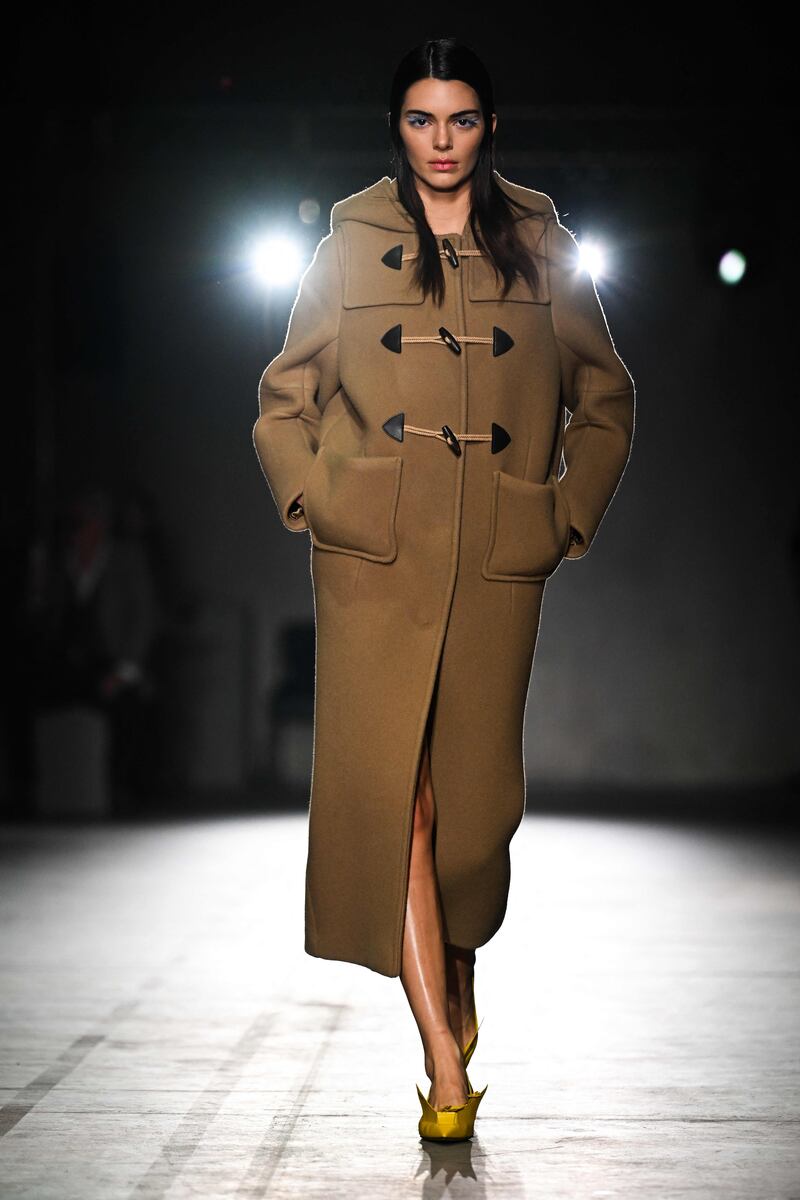 Model Kendall Jenner in a duffle coat at Prada. AFP