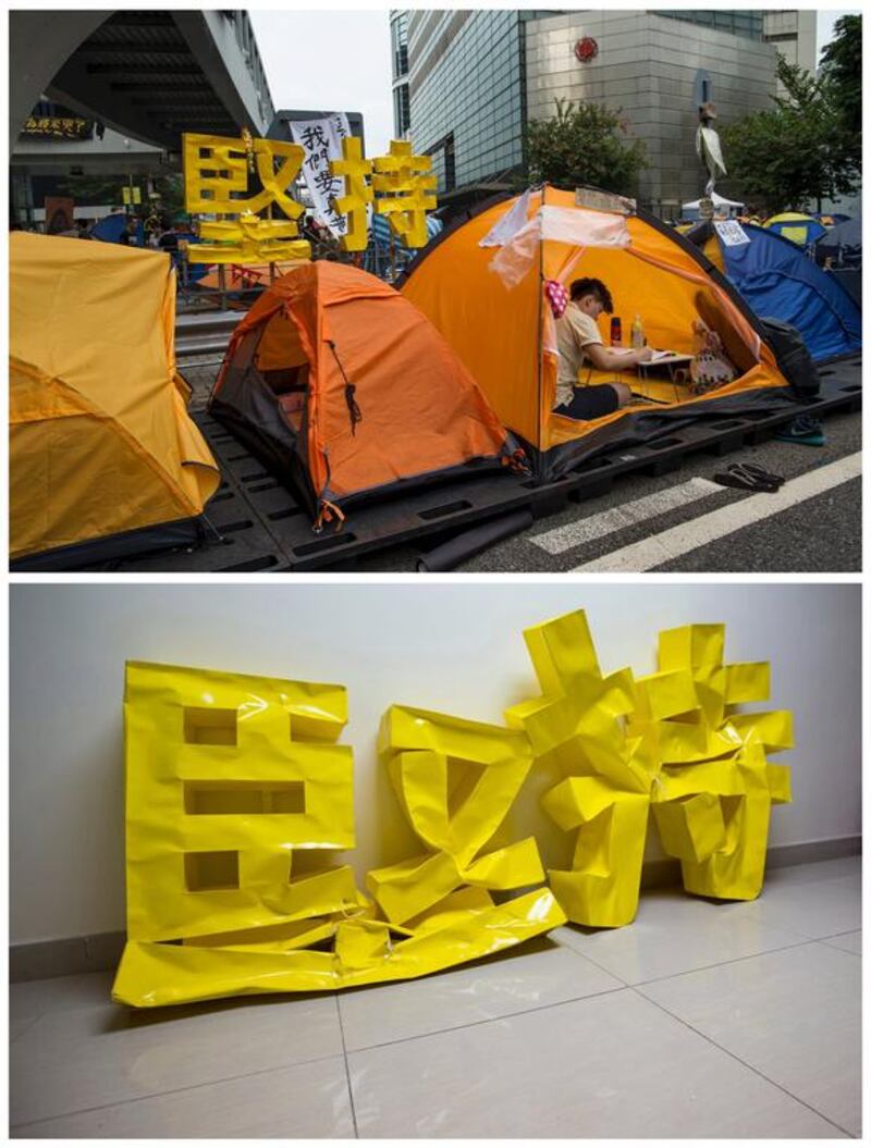 Top, a student does his homework in a tent with a sign that reads, "persist on" in the background in the financial Central district in Hong Kong on October 25, 2014, and bottom, the same sign on September 23, 2015. Reuters