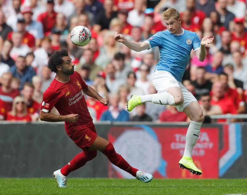 Manchester City's Kevin De Bruyne beats Mohamed Salah to the ball to set up Manchester City's goal in the first half. AP Photo