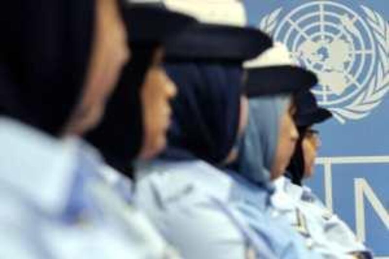 Bahraini female officers take part in yesterday’s graduation ceremony at the UN House in Manama 