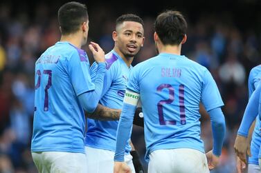 Gabriel Jesus celebrates with Manchester City teammates after scoring their fourth and his second goal against Fulham at the Etihad Stadium. AFP