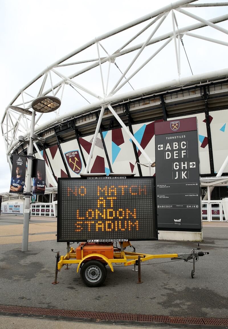 File photo dated 15-03-2020 of A view of an LED sign informing fans that the game is off outside the London Stadium, home of West Ham United Football Club.PA Photo. Issue date: Monday May 11, 2020. There will be no professional sport, even behind closed doors, in England until at least June 1, the UK Government has announced. See PA story SPORT Coronavirus. Photo credit should read Steven Paston/PA Wire.