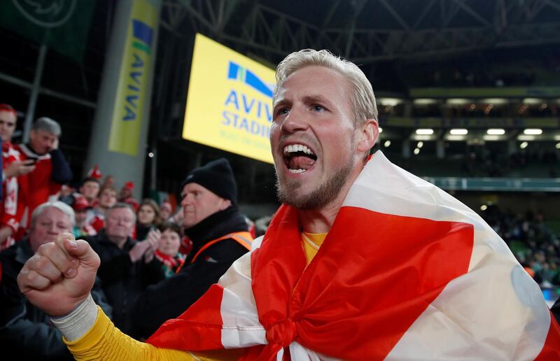 Denmark goalkeeper Kasper Schmeichel celebrates in front of their fans after the match. Reuters