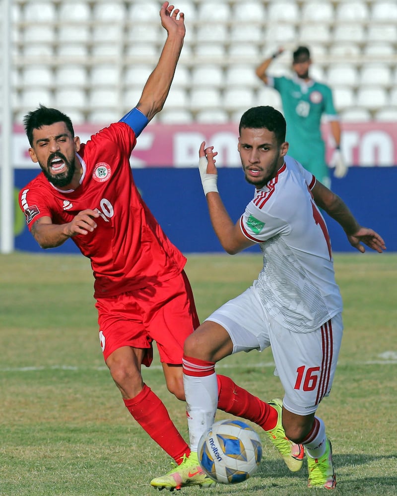 UAE defender Alhasan Saleh under pressure from Mohamad Haidar of Lebanon. AFP