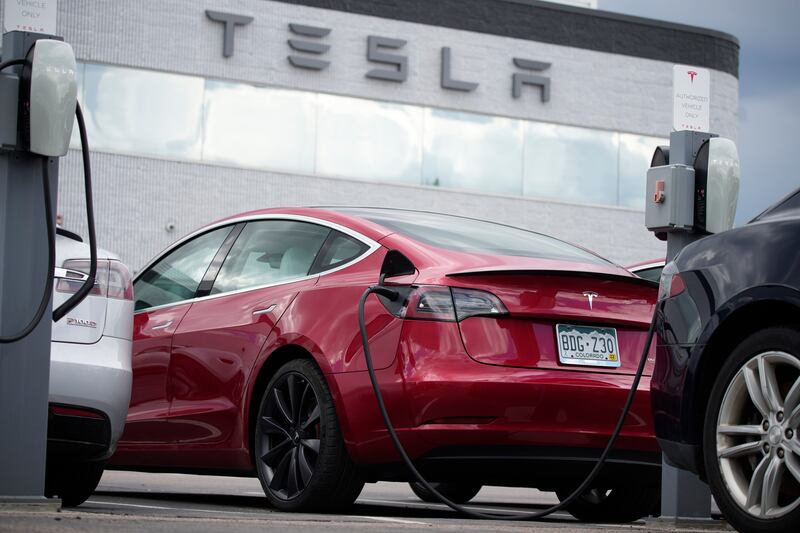 A Model 3 sedan at a Tesla dealership. A US probe into the electric car maker's Autopilot driver-assistance technology now applies to 830,000 cars. AP