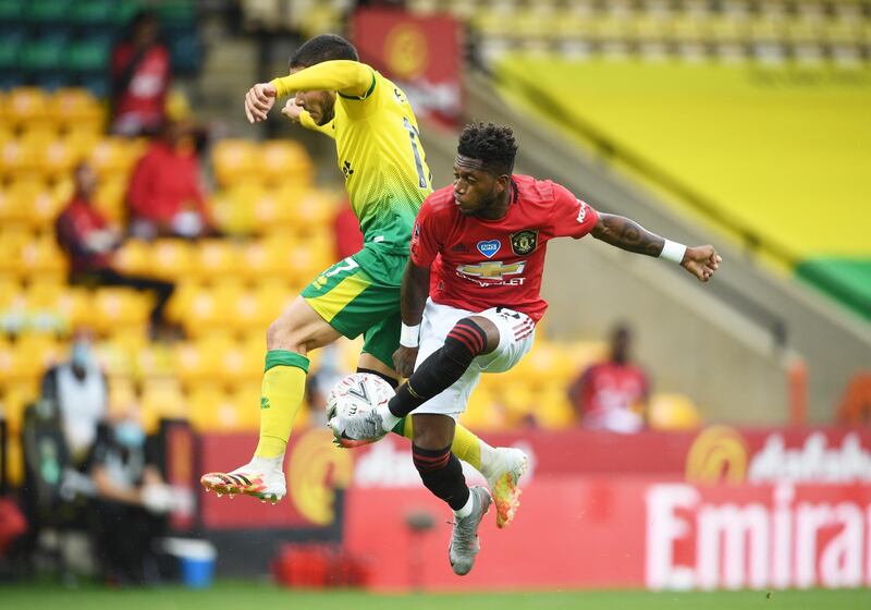United's Fred battles for possession with Emiliano Buendia of Norwich. Reuters