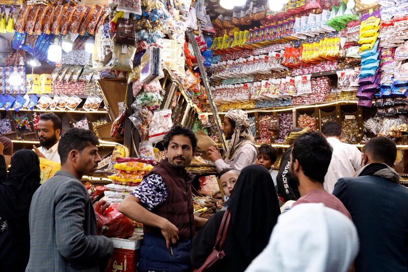 Yemenis shop for the Muslim festival of Eid Al Fitr, at a market in Sanaa, Yemen, on May 20, 2020. EPA