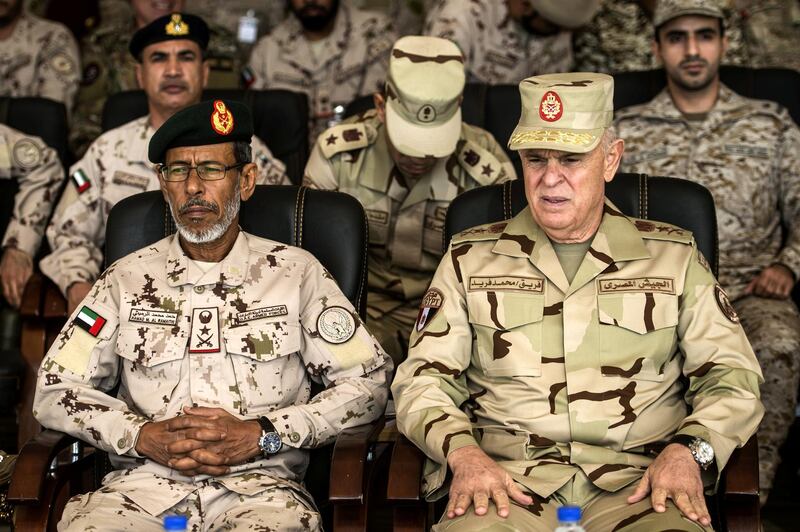 Egyptian army Chief of Staff Mohamed Farid (R), and his Emirati counterpart Hamad Mohammed al-Rumaith attend the Arab Shield military exercises in the Matrouh Governorate Mohamed Naguib miilitary base, northwest of the capital Cairo on November 15, 2018. - Forces from Saudi Arabia, Egypt, the UAE, Kuwait, Bahrain and Jordan are taking part in the maneuvers. (Photo by Khaled DESOUKI / AFP)