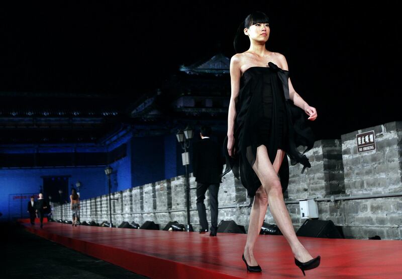 A Pierre Cardin fashion show takes place on the ancient city walls of Beijing, China, in March 2007. AFP