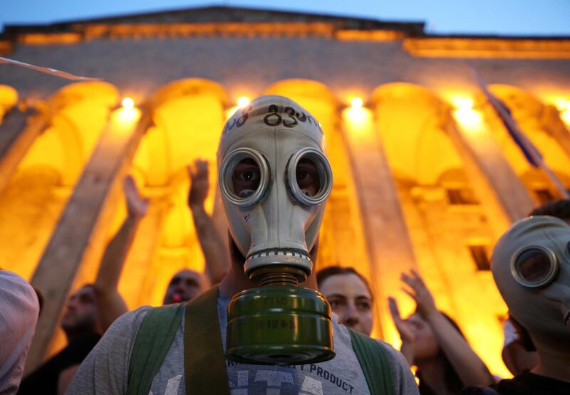 A protester attends a rally against a Russian lawmaker's visit near the parliament building in Tbilisi, Georgia.  Reuters