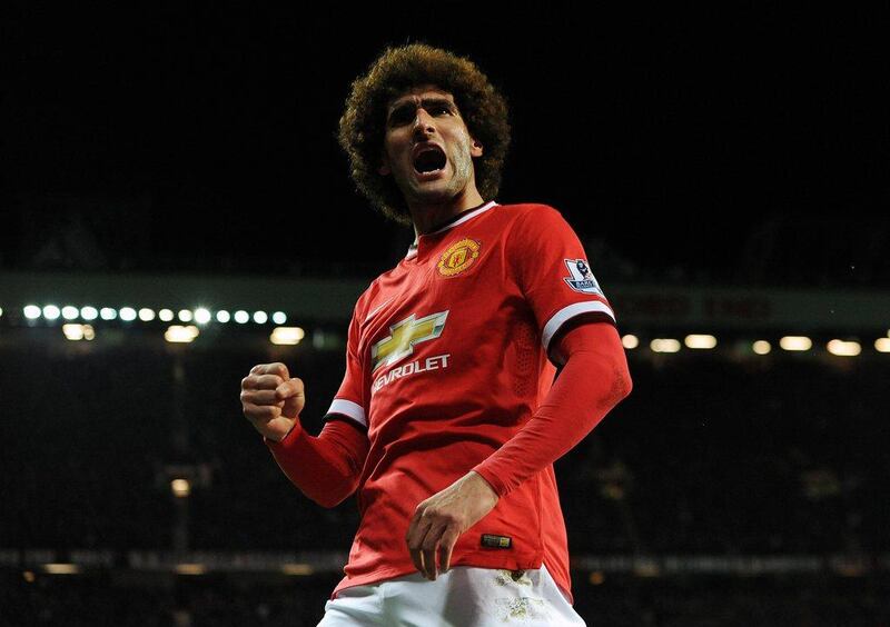 Manchester United's Marouane Fellaini celebrates scoring the opening goal during the club's 2-1 win over Stoke City on Tuesday in the Premier League. Peter Powell / EPA / December 2, 2014 