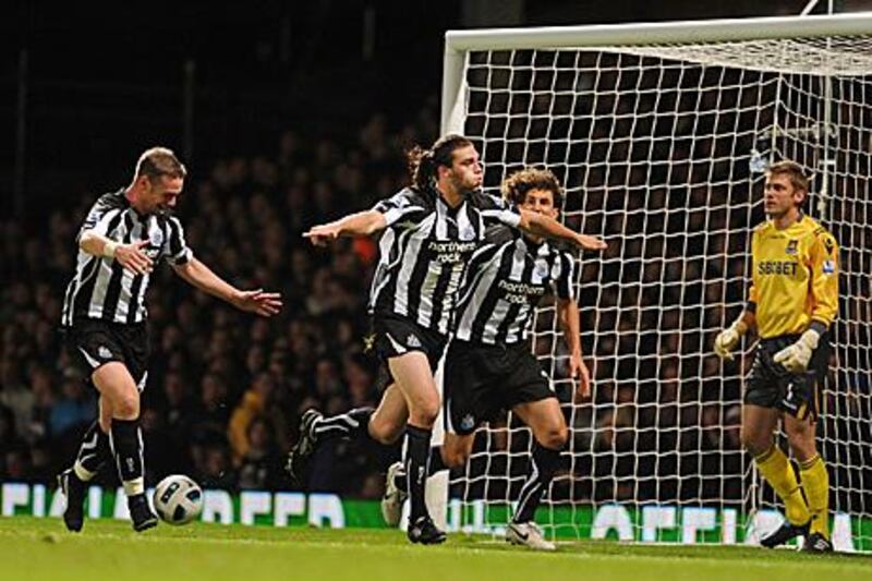 Andy Carroll, second from left, celebrates scoring Newcastle’s winner against West Ham.