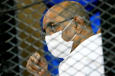Sudan's ousted President Omar Al Bashir inside the defendant's cage during his and some of his former allies trial in Khartoum. Reuters