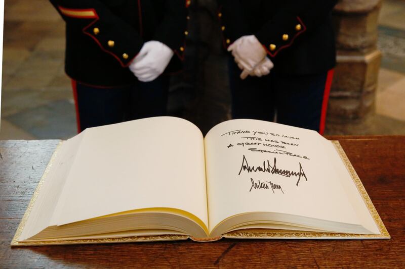 The Distinguished Visitors' Book, signed by US President Donald Trump and US First Lady Melania Trump, sits on a table at Westminster Abbey in London, UK. Bloomberg