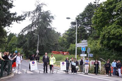 People wait next to the entrance of Mont Valerien cemetery, where Nahel was laid to rest in Nanterre. EPA