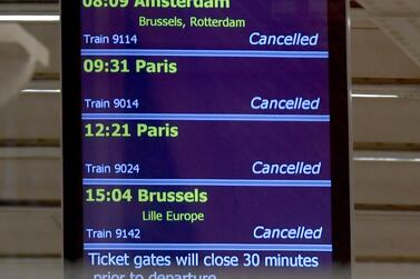 A screen shows cancellations at the Eurostar terminal at Kings Cross St Pancras train station in London. EPA