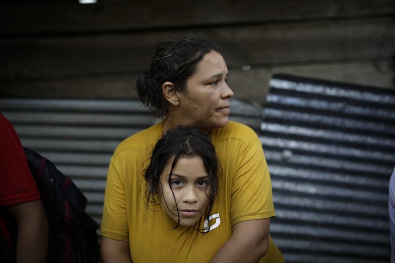 Kaoly Becerra, 40, a Venezuelan migrant, hugs her daughter, Ambar Castillo, 8, in Bajo Chiquito, Panama.  EPA