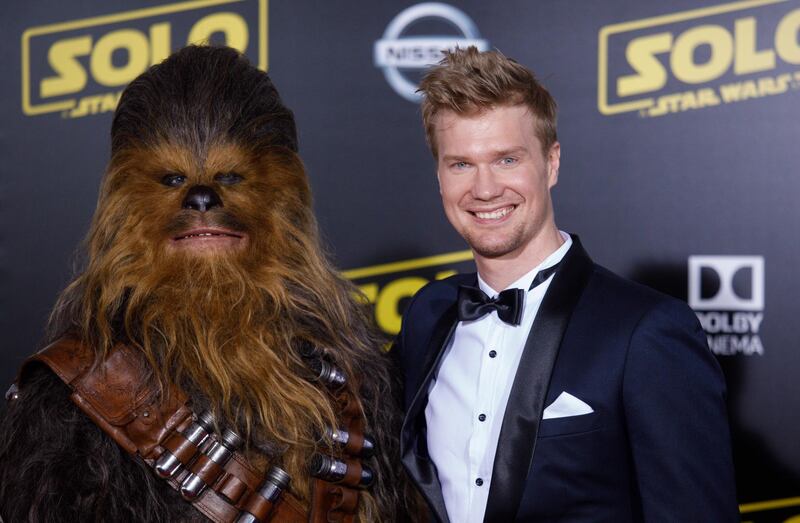 Finnish actor Joonas Suotamo right and his character Chewbacca pose on the red carpet at the premiere of 'Solo: A Star Wars Story' in Hollywood. Eugene Garcia / EPA