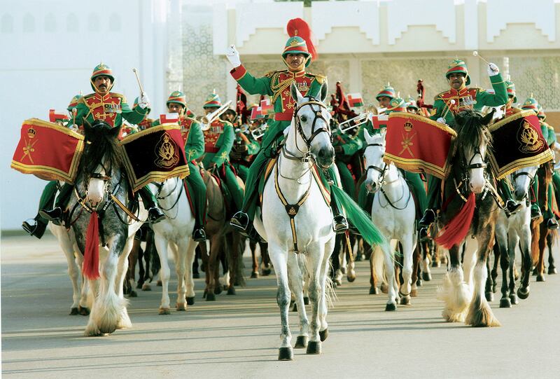The Omani Royal Equestrian and Cavalry horse-mounted band plays during ceremonies to mark the National Day in Muscat in 2008.  EPA