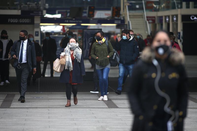 Commuters arrive at Victoria station, central London. AFP