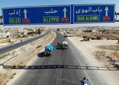 Syrian civilians flee on August 21, 2019 a conflict zone in Syria's rebel-held northwestern region of Idlib, where government bombardment has killed hundreds since late April. Damascus said on August 22 it is opening a corridor for civilians to leave the Idlib province. Damascus has opened such corridors out of other rebel bastions in the past as a prelude to retaking them either by force or through negotiated surrenders. The Idlib region, which sits on the Turkish border, is now the last major stronghold of opposition to the Russia-backed government of President Bashar al-Assad.
 / AFP / Omar HAJ KADOUR
