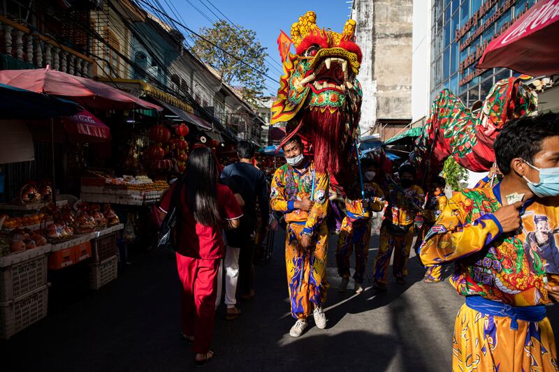Thai dragon dancers perform on the streets of Chinatown in Bangkok. Owing to a rise in Covid-19 cases, authorities officially cancelled all public celebrations during the Chinese Lunar New Year. However, people continue to celebrate in Bangkok's Chinatown, at Chinese temples and Yaowarat Walking Street. Getty Images