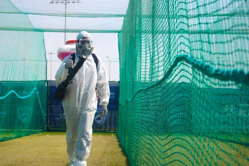Workers in PPE disinfecting the practice area at Abu Dhabi Cricket in order for Mumbai Indians and Kolkata Knight Riders to train ahead of the IPL. Courtesy Abu Dhabi Cricket