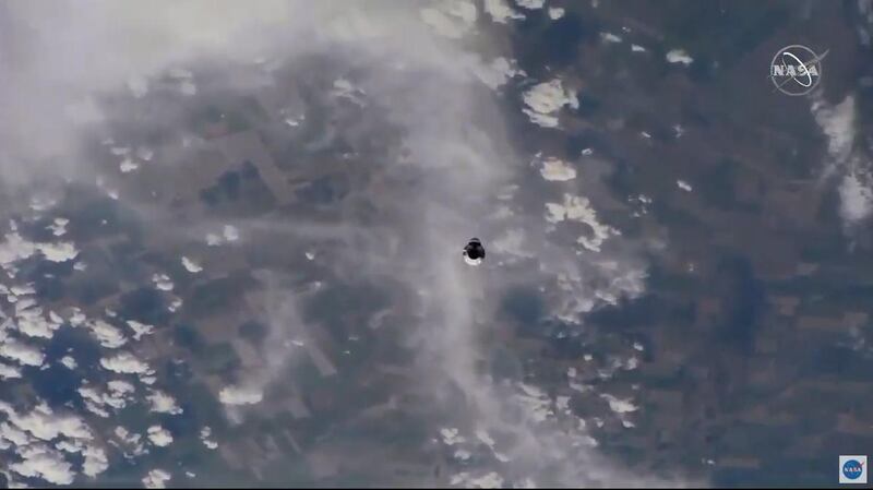 SpaceX Crew Dragon is seen from the International Space Station during the spacecraft's approach to the orbiting laboratory. Nasa TV / EPA