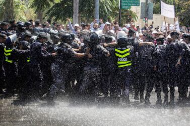 Jordanian teachers clash with security forces during a protest in the capital Amman on September 5, 2019. AFP