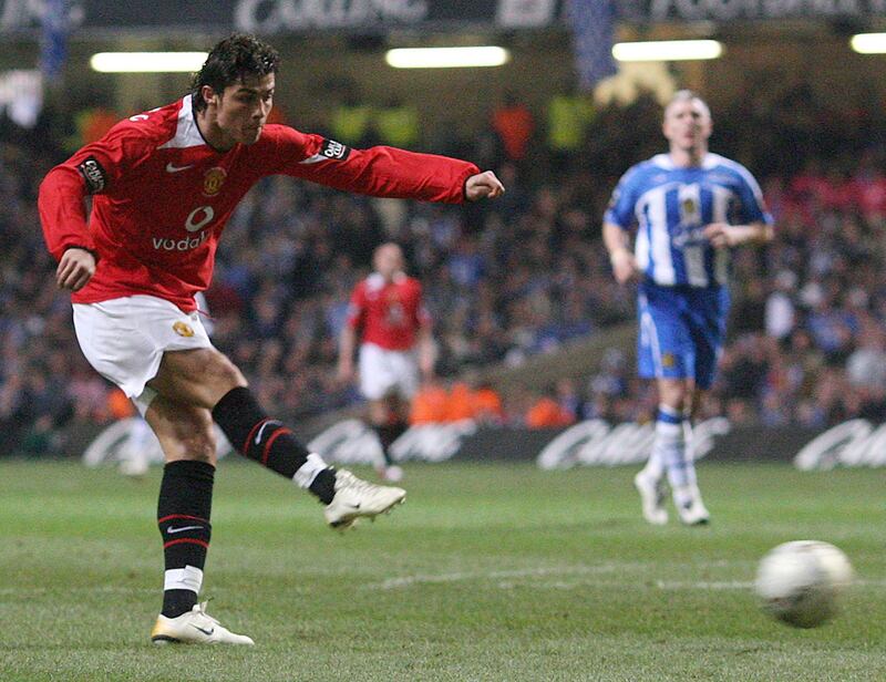 Manchester United's Ronaldo scores against Wigan Athletic during their English League Cup final soccer match at the Millennium Stadium in Cardiff, south Wales, February 26, 2006. NO ONLINE/INTERNET USE WITHOUT A LICENCE FROM THE FOOTBALL DATA CO LTD.  FOR LICENCES ENQUIRIES PLEASE TELEPHONE +44 207 298 1656.    REUTERS/Eddie Keogh