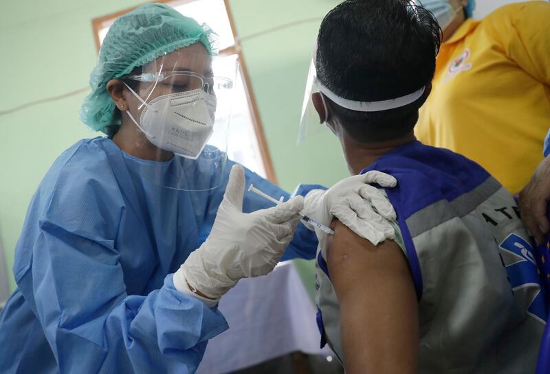 A health worker receives a dose of Covishield Covid-19 vaccine at Yangon General Hospital, in Yangon, Myanmar. EPA