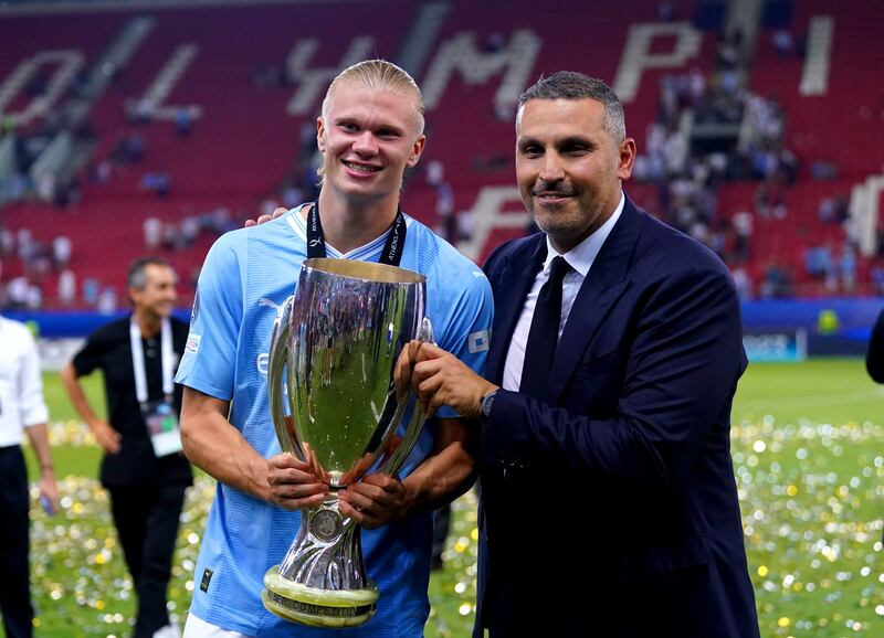 Manchester City chairman Khaldoon Al Mubarak and Erling Haaland with the Super Cup trophy. PA
