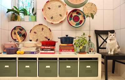 Chef Nicole Barua makes storage look stylish in her kitchen. Even the cat seems impressed