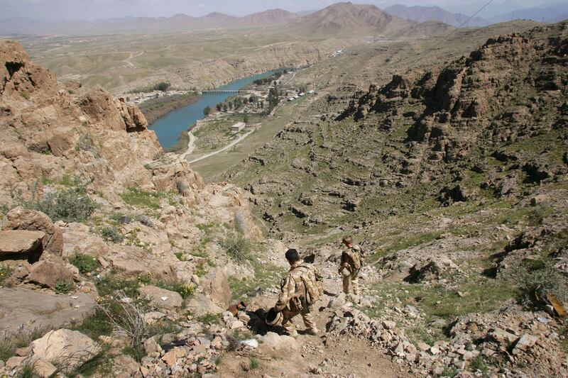 KAJAKI, AFGHANISTAN - MARCH 13:  British commandos descend from a mountain observation post overlooking the beginning of the Helmand River at the Kajaki hydroelectric dam March 13, 2007 in Afghanistan's southern Helmand province. Some 4,500 NATO forces are battling Taliban in the area as part of Operation Achilles, the largest NATO operation yet in Afghanistan. The main objective of the offensive is to clear Taliban from the area in order to upgrade the dam, which currently provides electricity to much of southern Afghanistan. The USAID funded project would be one of the largest development projects in Afghanistan, providing electricity to millions more Afghans. Earlier work on the dam, which was built by the United States in 1975, was suspended June 4, 2006 due to Taliban attacks.  (Photo by John Moore/Getty Images)