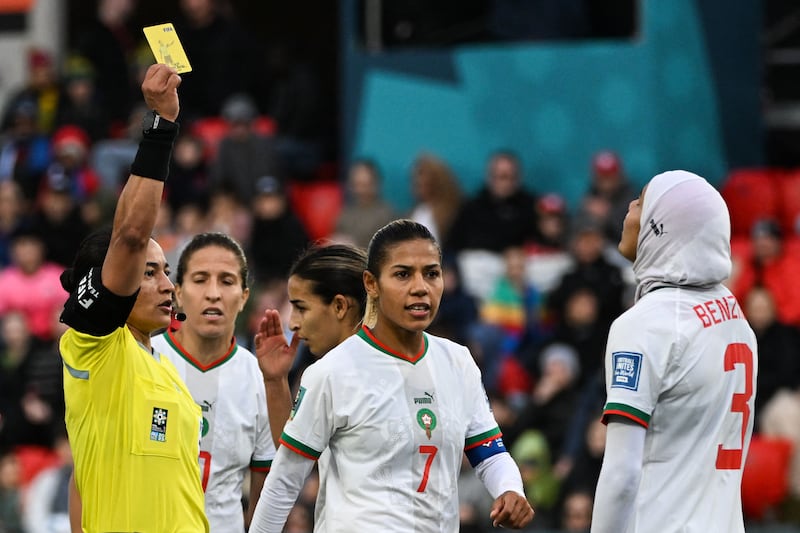 Morocco's Nouhaila Benzina receives a yellow card from Brazilian referee Edina Alves.  AFP