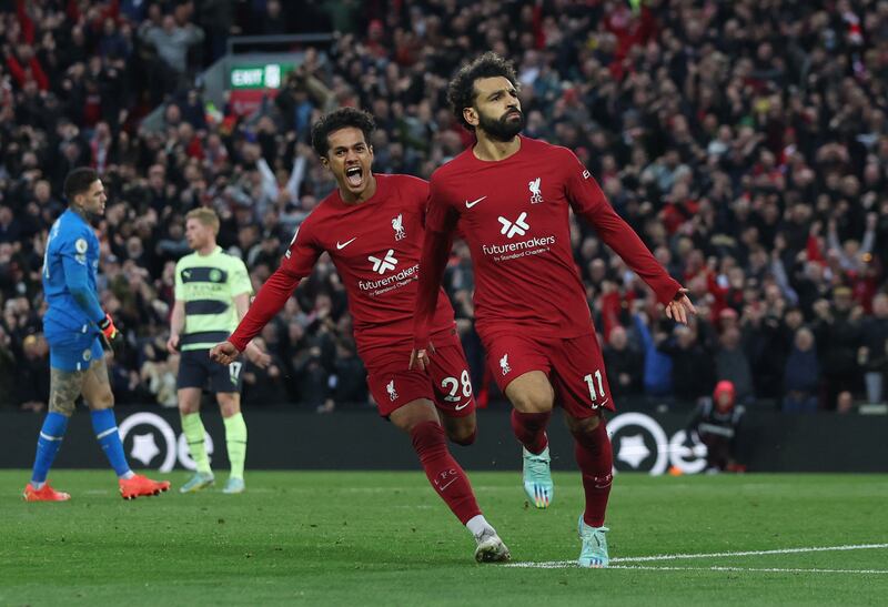 Liverpool's Mohamed Salah celebrates with Fabio Carvalho after scoring the only goal in their Premier League win over Manchester City at Anfield on Sunday, October 16, 2022. Reuters