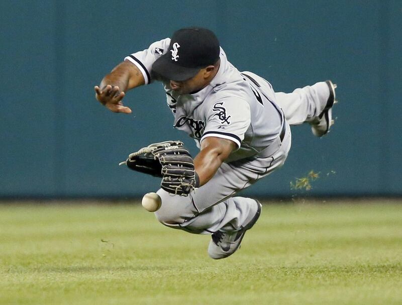 Right fielder Dayan Viciedo #24 of the Chicago White Sox can’t make a diving catch on a fly ball hit by Torii Hunter of the Detroit Tigers in the eighth inning at Comerica Park in Detroit, Michigan.   Duane Burleson / Getty 