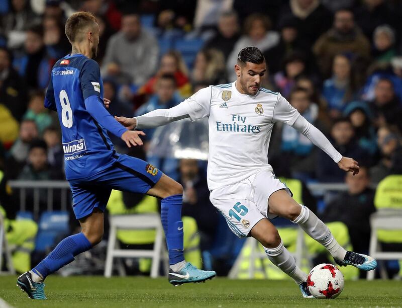 MADRID, SPAIN - NOVEMBER 28: Theo Hernandez of Real Madrid is challenged by Alvaro Bravo of Fuenlabrada during the Copa del Rey round of 32 second leg match between Real Madrid CF and Fuenlabrada at Estadio Santiago Bernabeu on November 28, 2017 in Madrid, Spain.  (Photo by Angel Martinez/Real Madrid via Getty Images)