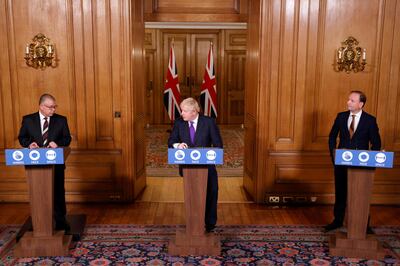 Britain's Prime Minister Boris Johnson, Chief Executive of the National Health Service, Simon Stevens, and Deputy Chief Medical Officer, Jonathan Van Tam attend a news conference on the ongoing situation with the coronavirus disease (COVID-19), at Downing Street in London, Britain December 2, 2020. REUTERS/John Sibley/Pool