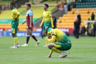 Soccer Football - Premier League - Norwich City v West Ham United - Carrow Road, Norwich, Britain - July 11, 2020 Norwich City's Max Aarons looks dejected after the match, as play resumes behind closed doors following the outbreak of the coronavirus disease (COVID-19) Pool via REUTERS/Alex Pantling EDITORIAL USE ONLY. No use with unauthorized audio, video, data, fixture lists, club/league logos or 'live' services. Online in-match use limited to 75 images, no video emulation. No use in betting, games or single club/league/player publications. Please contact your account representative for further details.