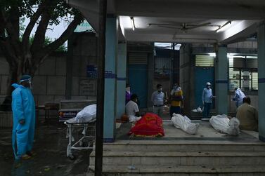 Covid-19 victims are seen outside a crematorium in New Delhi. AFP