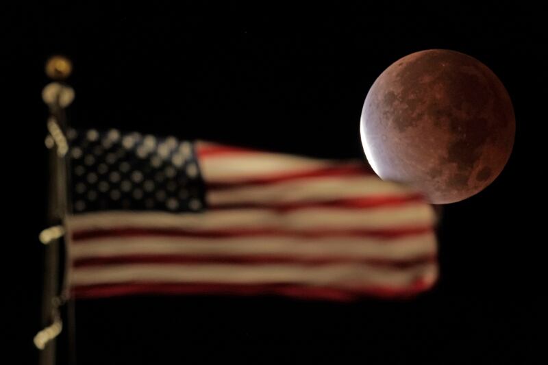 The Earth's shadow covers the full moon during a partial lunar eclipse on Friday, November 19, 2021, in Kansas City, Missouri. AP Photo