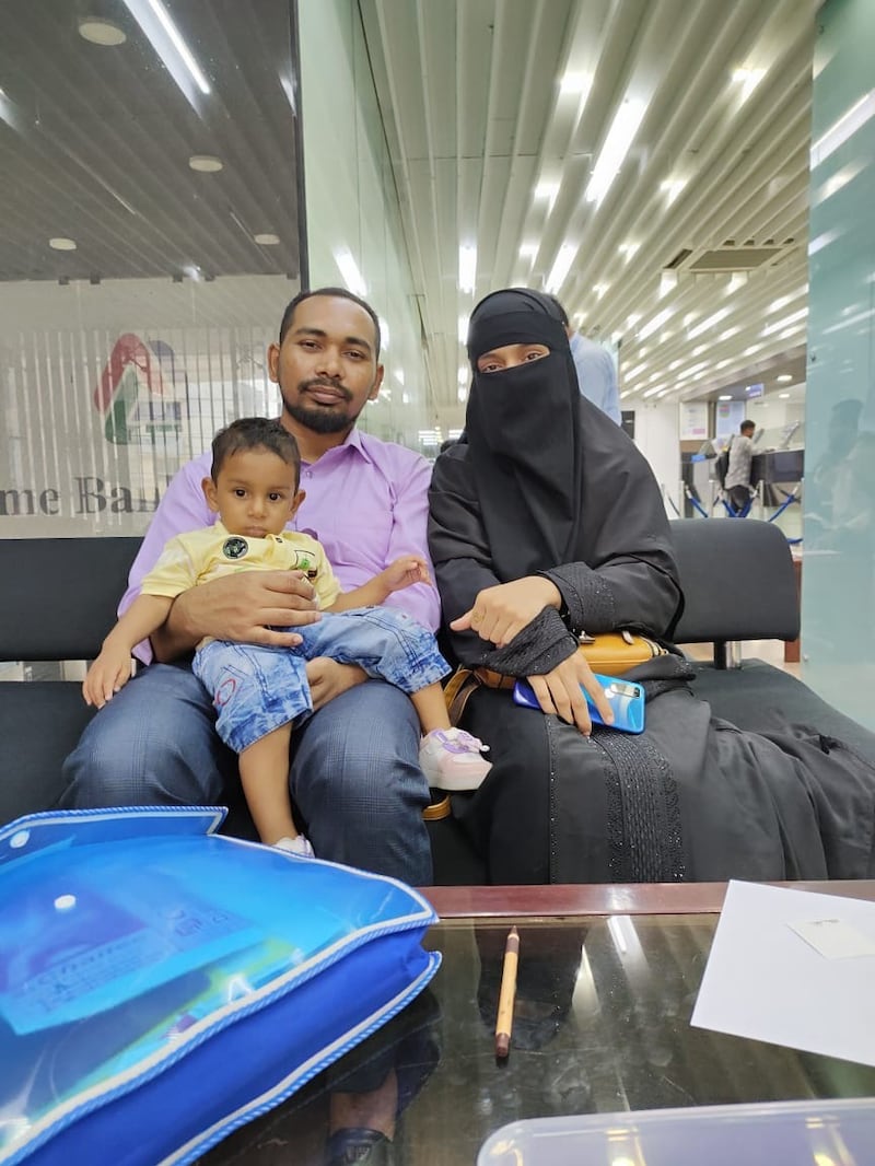 Mohammad Nooruddin with his wife and young son before boarding the cargo ship MV Abdullah that was seized by Somali pirates last month. Photo: SR Shipping