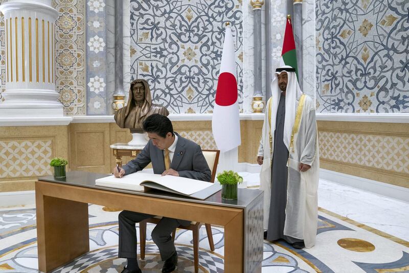 ABU DHABI, UNITED ARAB EMIRATES - January 13, 2020: HE Shinzo Abe, Prime Minister of Japan (L), signs the guestbook, during a reception, at Qasr Al Watan. Seen with HH Sheikh Mohamed bin Zayed Al Nahyan, Crown Prince of Abu Dhabi and Deputy Supreme Commander of the UAE Armed Forces (R).

( Mohamed Al Hammadi / Ministry of Presidential Affairs )
---