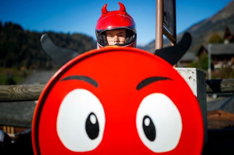 A young competitor prepares to race down a 450m track in a soapbox in the alpine resort of Les Diablerets, Switzerland. EPA