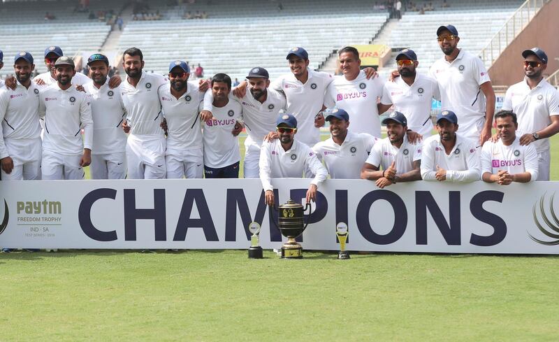 Members of Indian team pose with the winners trophy after their win on the fourth day of third and last cricket test match between India and South Africa in Ranchi, India, Tuesday, Oct. 22, 2019. Indian won the series 3-0. (AP Photo/Aijaz Rahi)