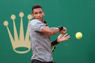 Canada's Felix Auger-Aliassime returns the ball to Chile's Cristian Garin during their first round singles match on day two of the Monte-Carlo ATP 1000 Masters Series tennis tournament in Monte-Carlo, Monaco on April 12, 2021.  / AFP / Valery HACHE
