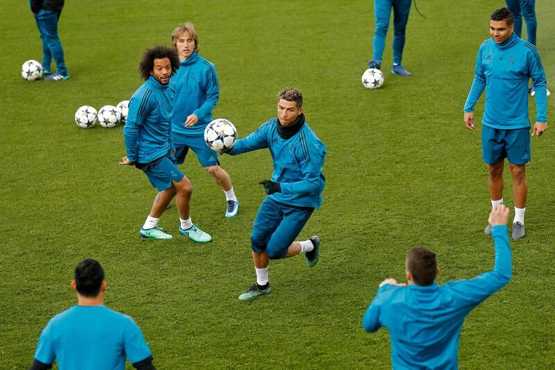 Cristiano Ronaldo, centre, takes part in training with his Real Madrid teammates ahead of the Uefa Champions League semi-final, second leg against Bayern Munich. Francisco Seco / AP Photo